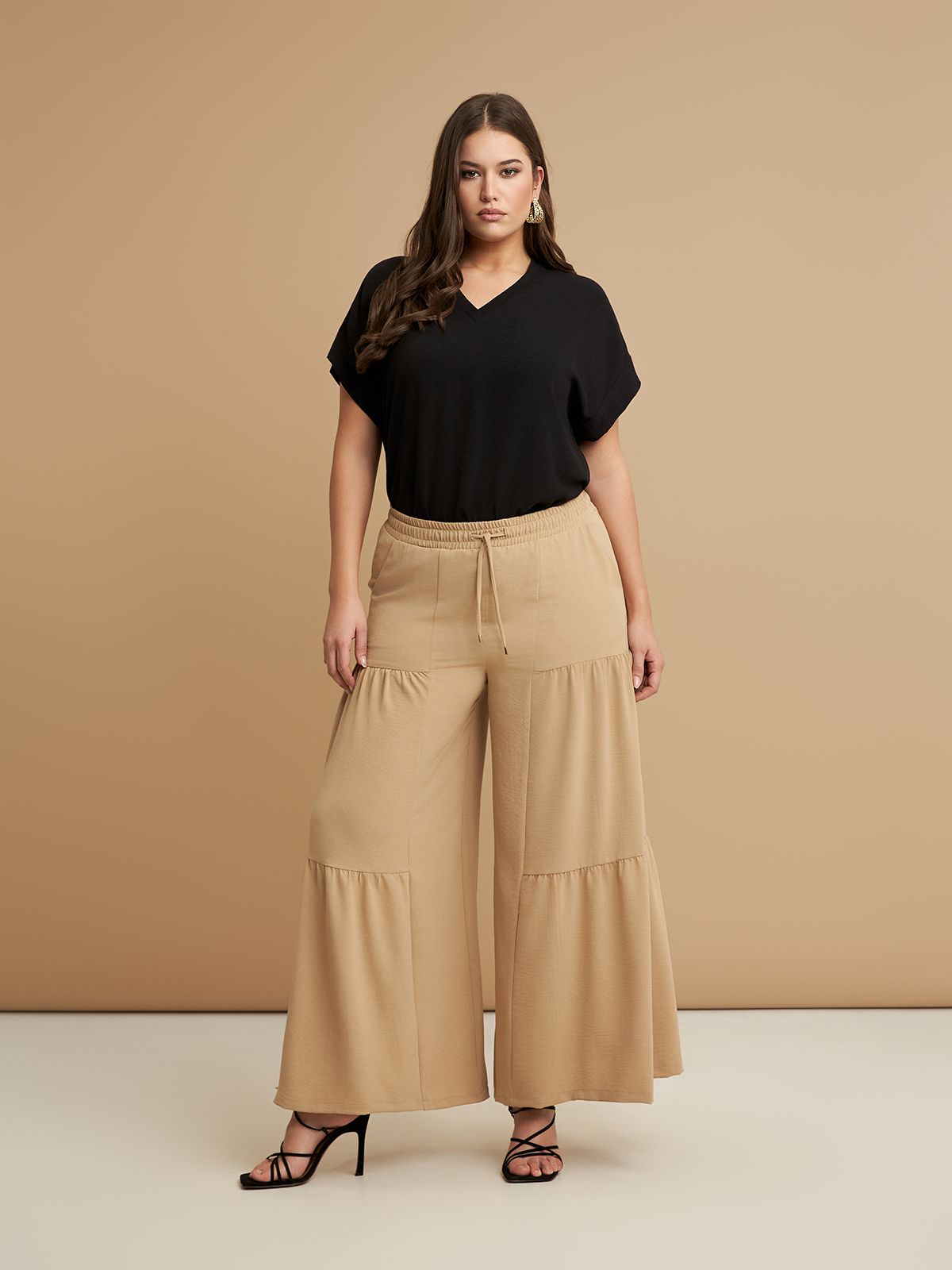 Mat Fashion Ψηλόμεση wide-leg παντελόνα με βολάν Μπεζ