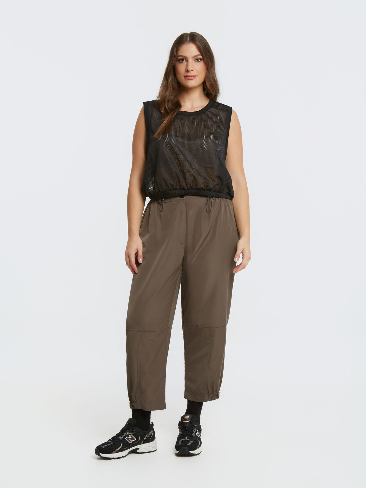Mesh sleeveless top with adjustable drawstring hem