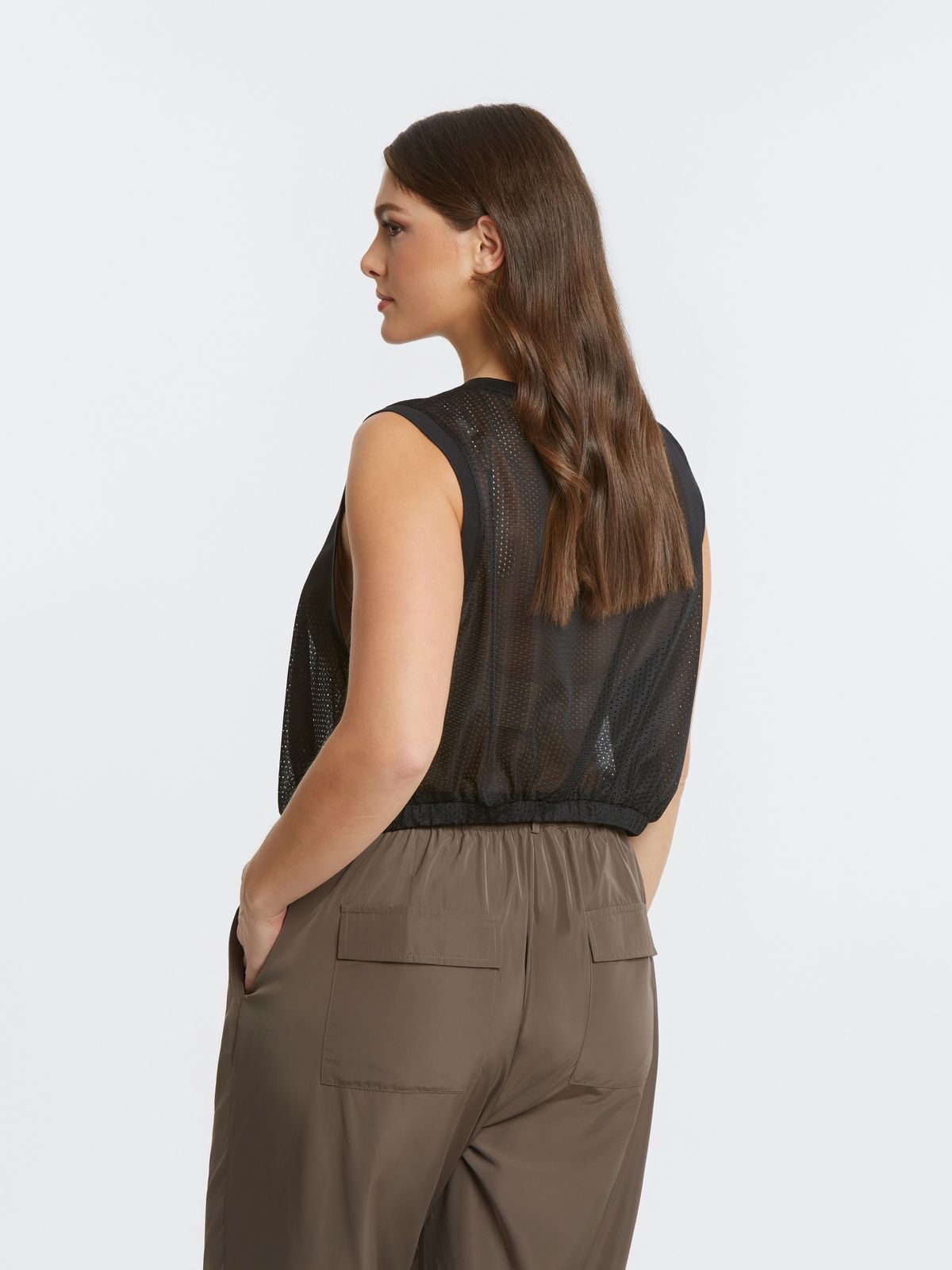 Mesh sleeveless top with adjustable drawstring hem