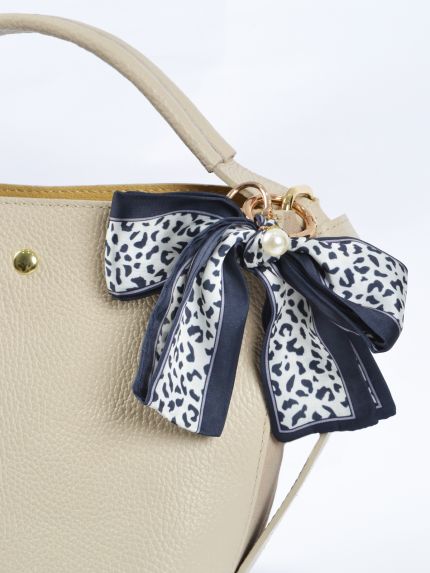 Leopard print bow bag charm with pearl detail